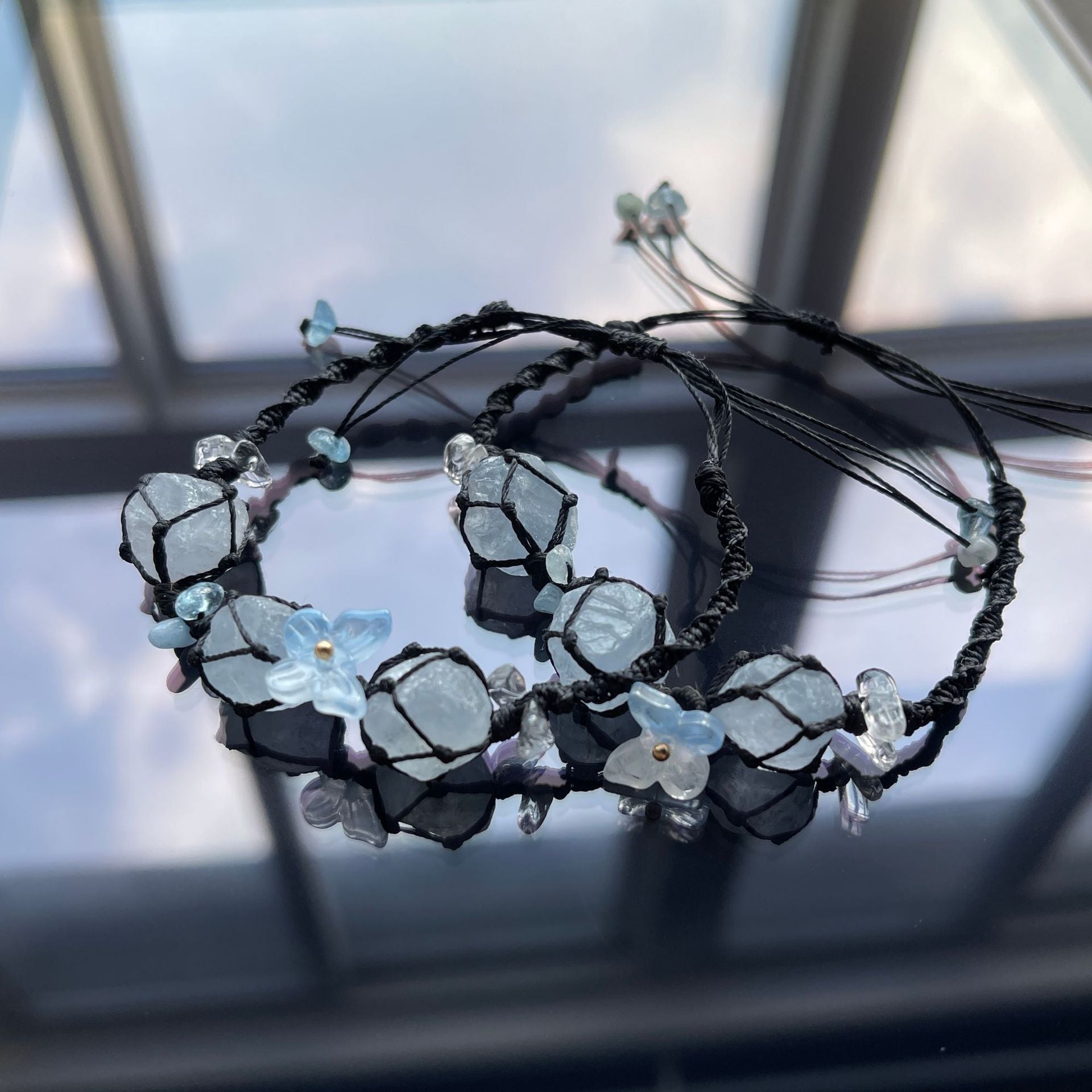 Handmade crystal bracelet with blue fluorite and floral accents - a touch of nature