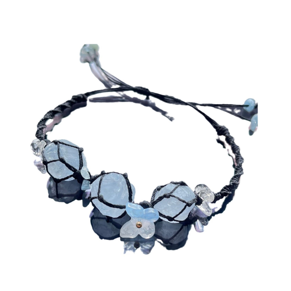 Handmade crystal bracelet with blue fluorite and floral accents - a touch of nature