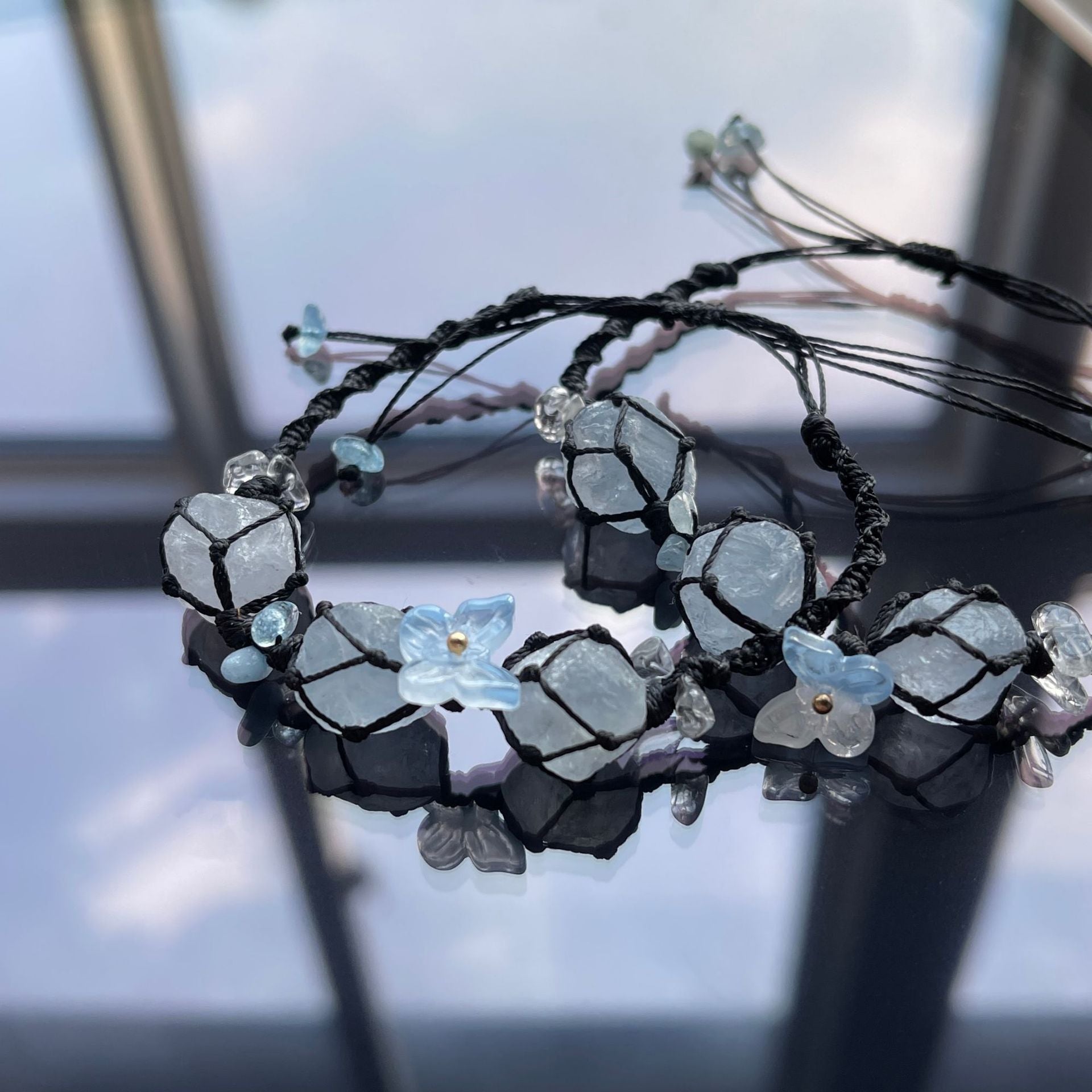 Handmade crystal bracelet with blue fluorite and floral accents - a touch of nature
