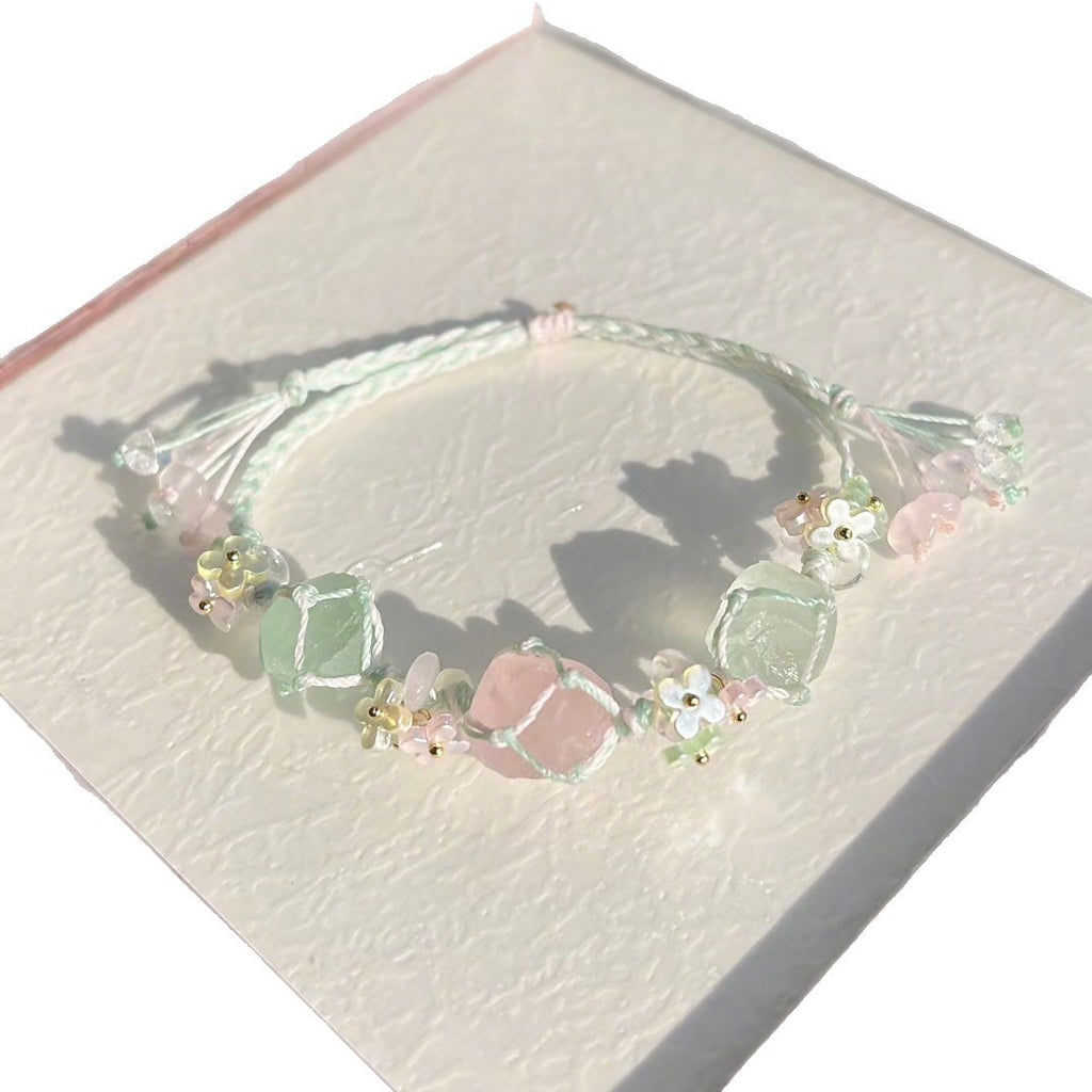 Handmade braided bracelet with rose quartz and green raw stone
