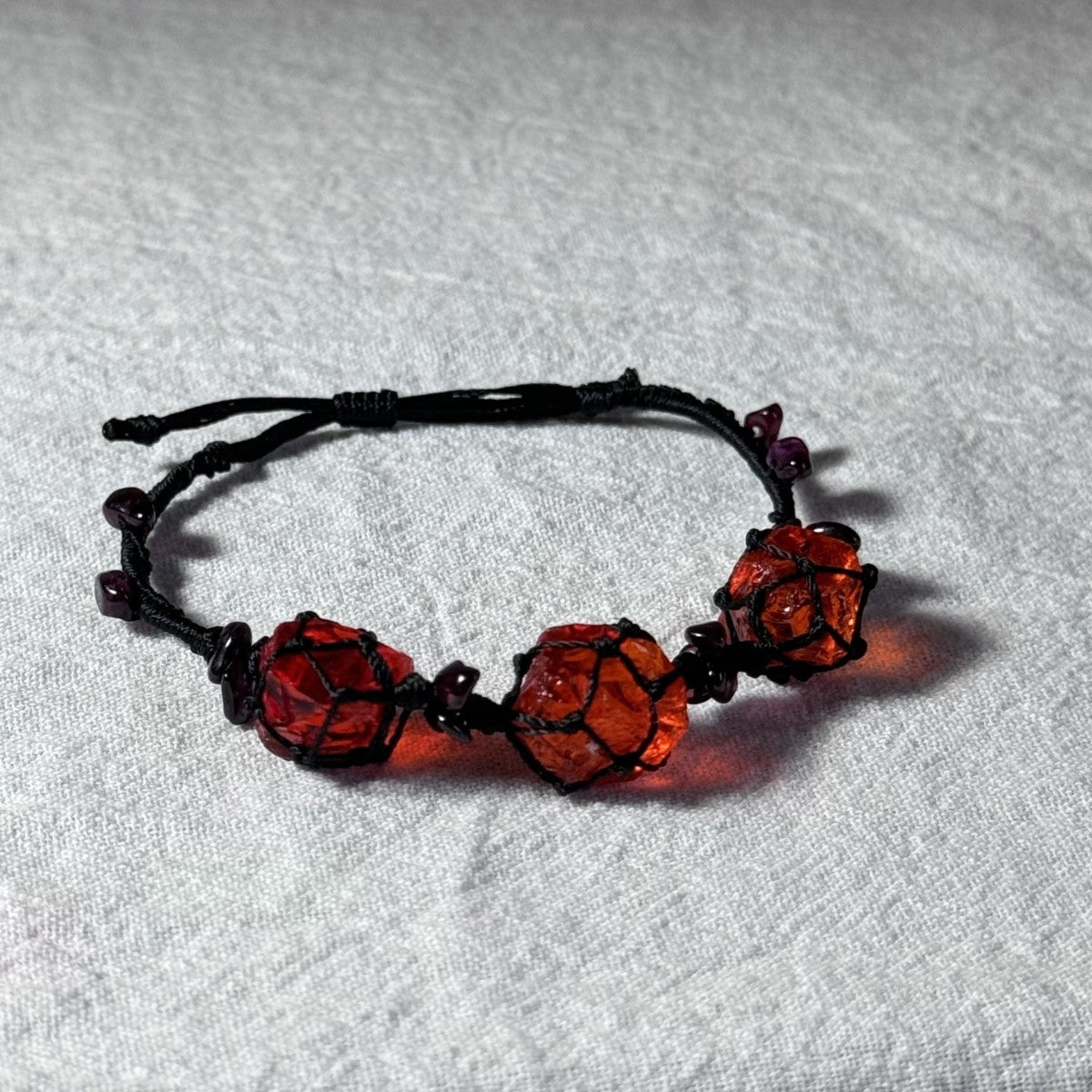 Original garnet bracelet with red glass beads and hand-woven design