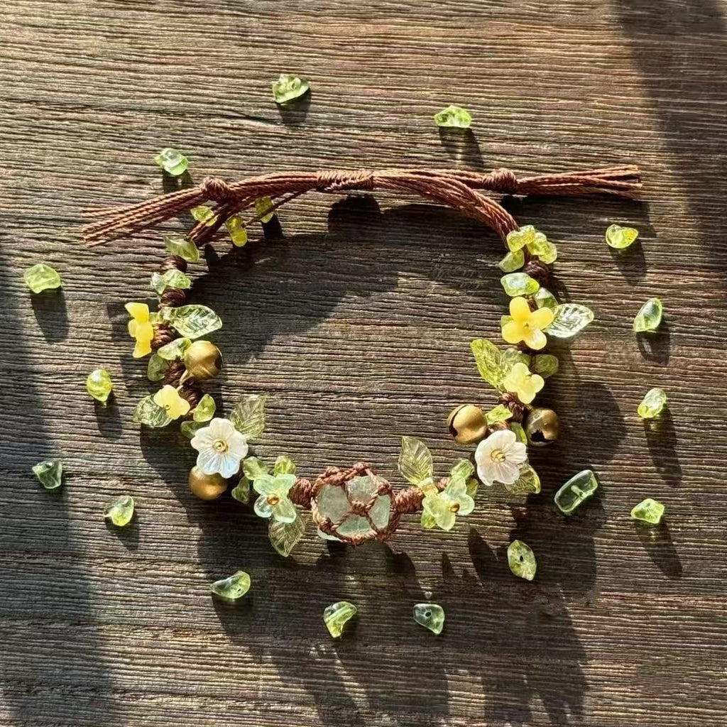 Green handmade woven forest style floral wreath bracelet with raw crystal beads