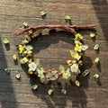 Green handmade woven forest style floral wreath bracelet with raw crystal beads