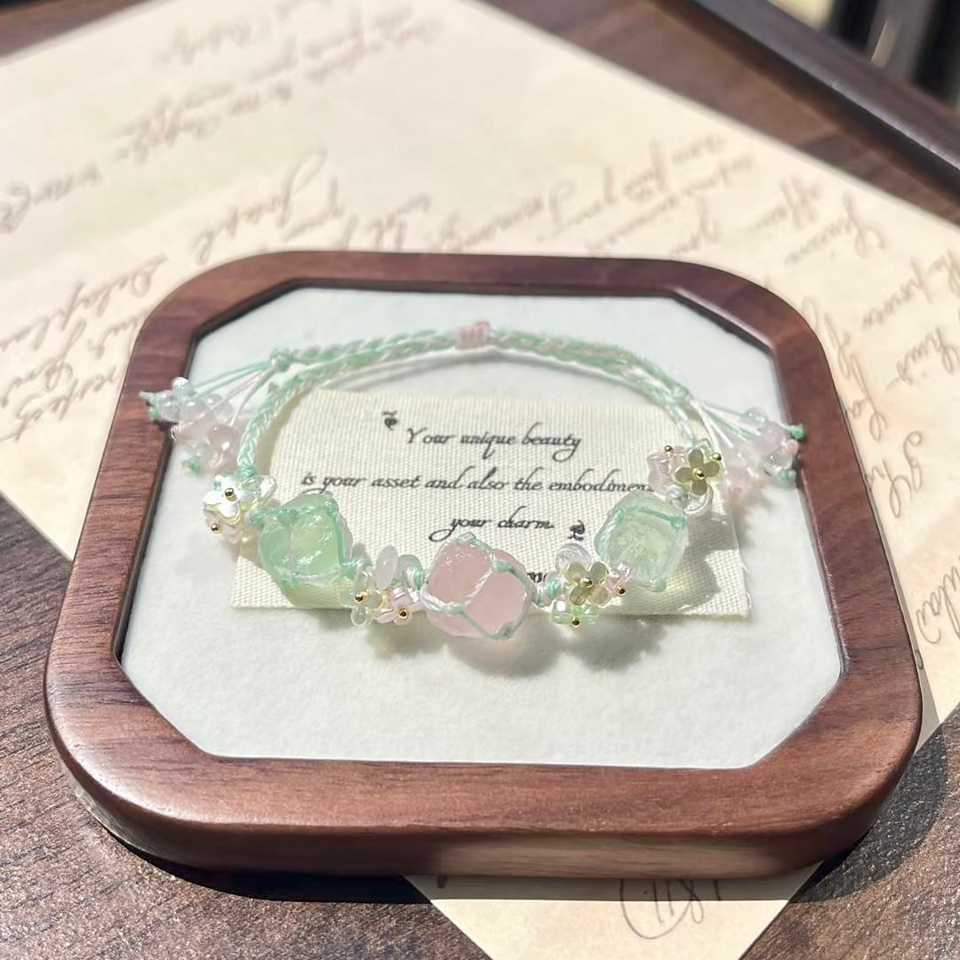 Handmade braided bracelet with rose quartz and green raw stone