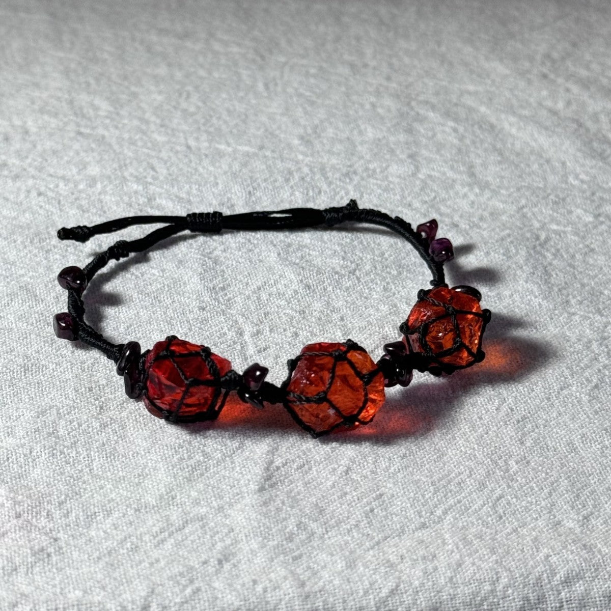 Original garnet bracelet with red glass beads and hand-woven design