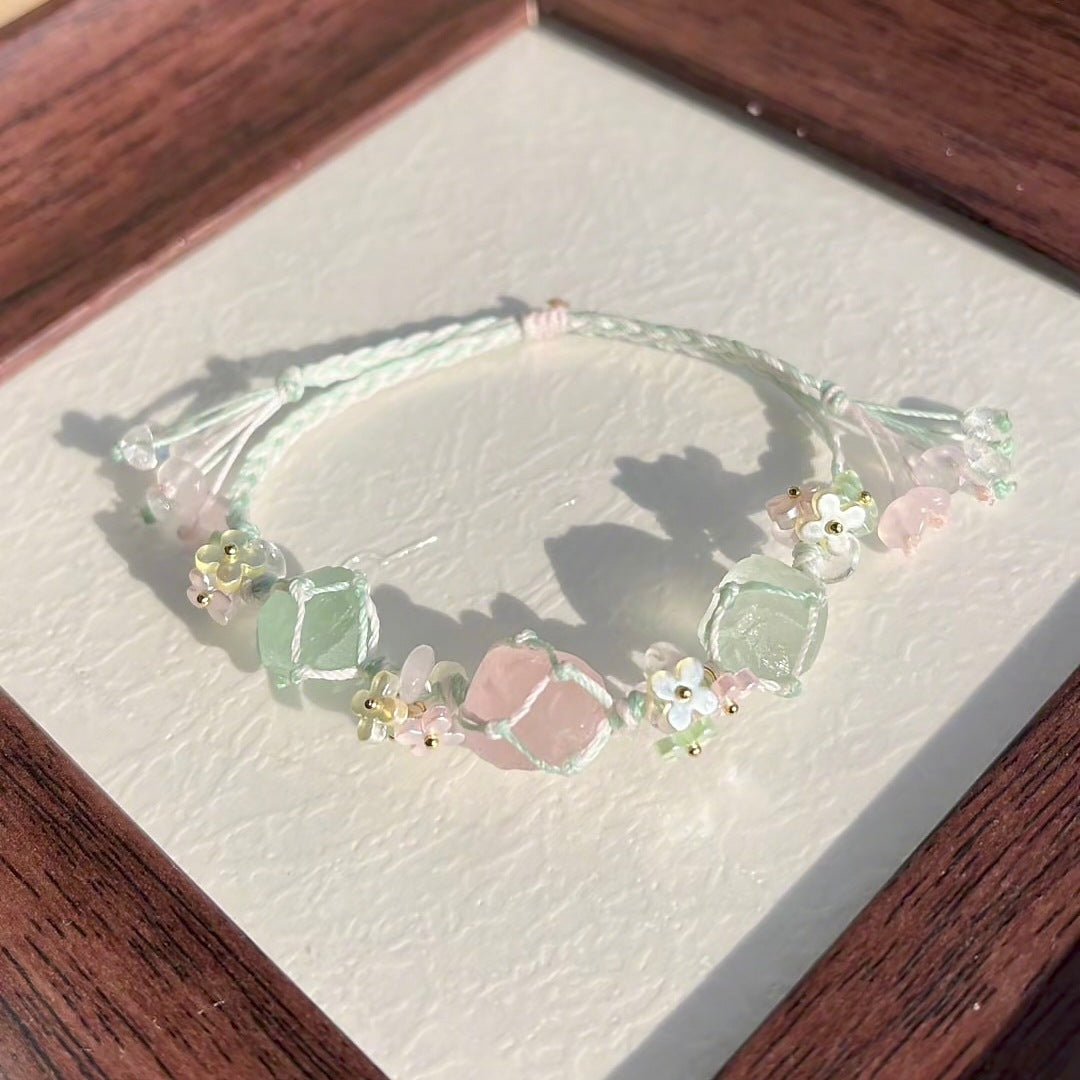 Handmade braided bracelet with rose quartz and green raw stone