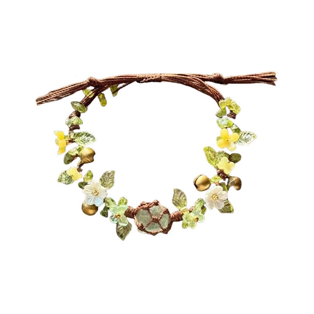 Green handmade woven forest style floral wreath bracelet with raw crystal beads