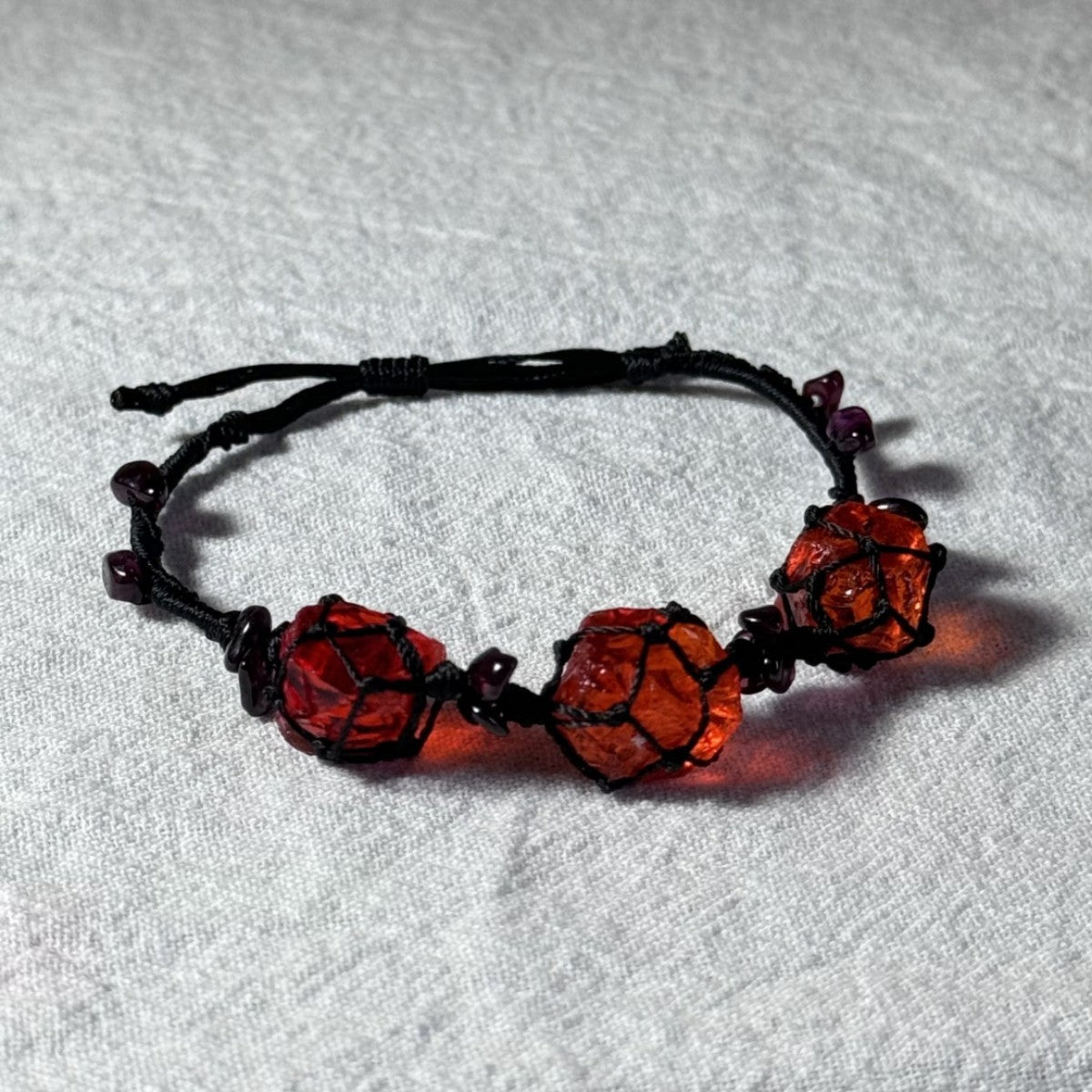 Original garnet bracelet with red glass beads and hand-woven design